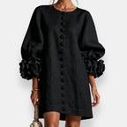 The elegant balloon sleeves of the brown embossed floral dress, adding a touch of volume and sophisticated charm.