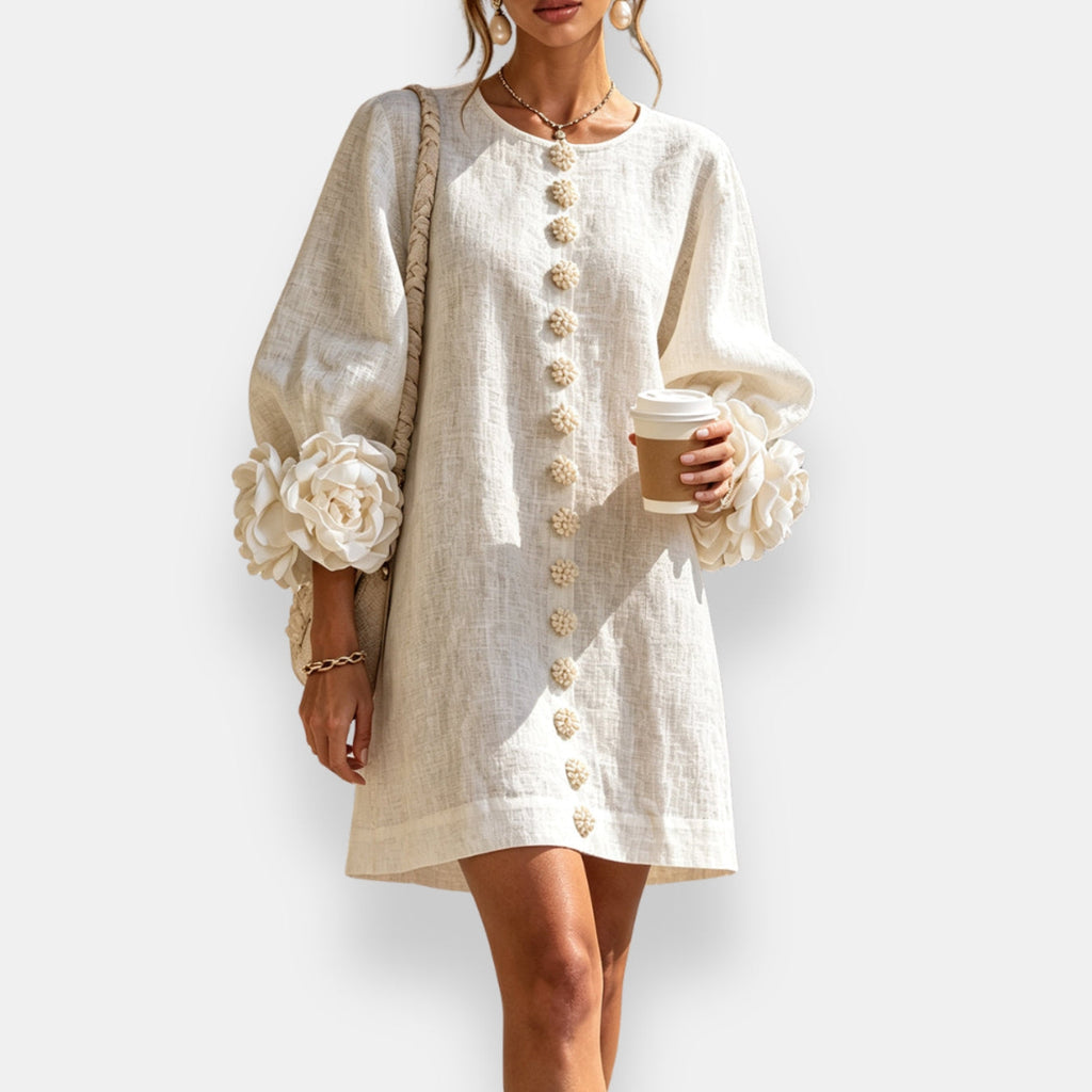Side profile of a model wearing the black embossed floral dress, highlighting the balloon sleeves and comfortable fit.
