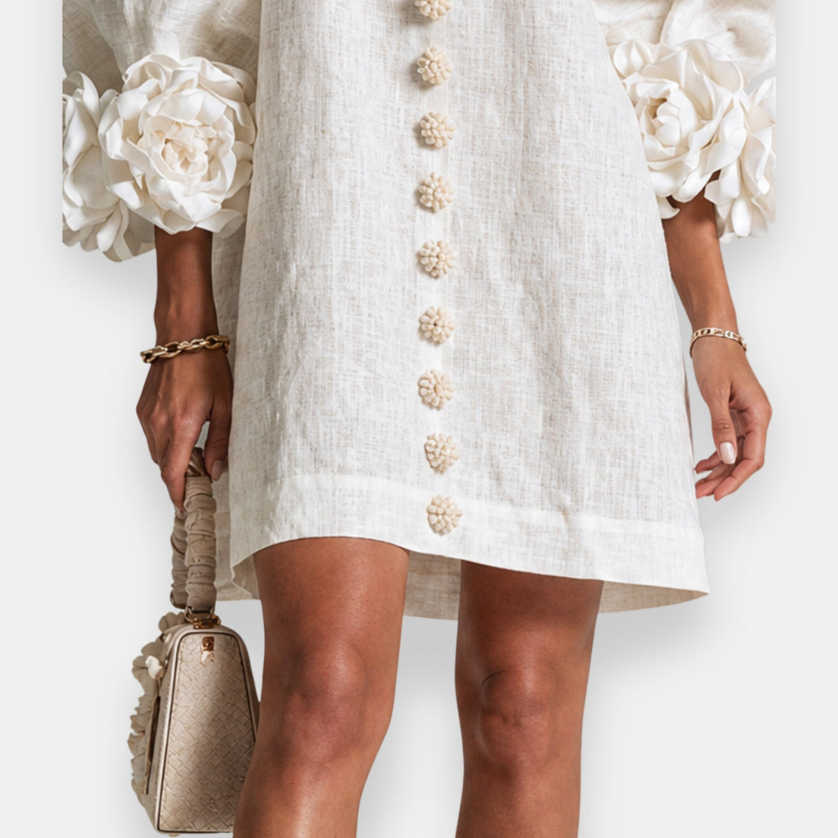 Back view of the blue embossed floral dress, revealing its relaxed fit and graceful drape for summer comfort.