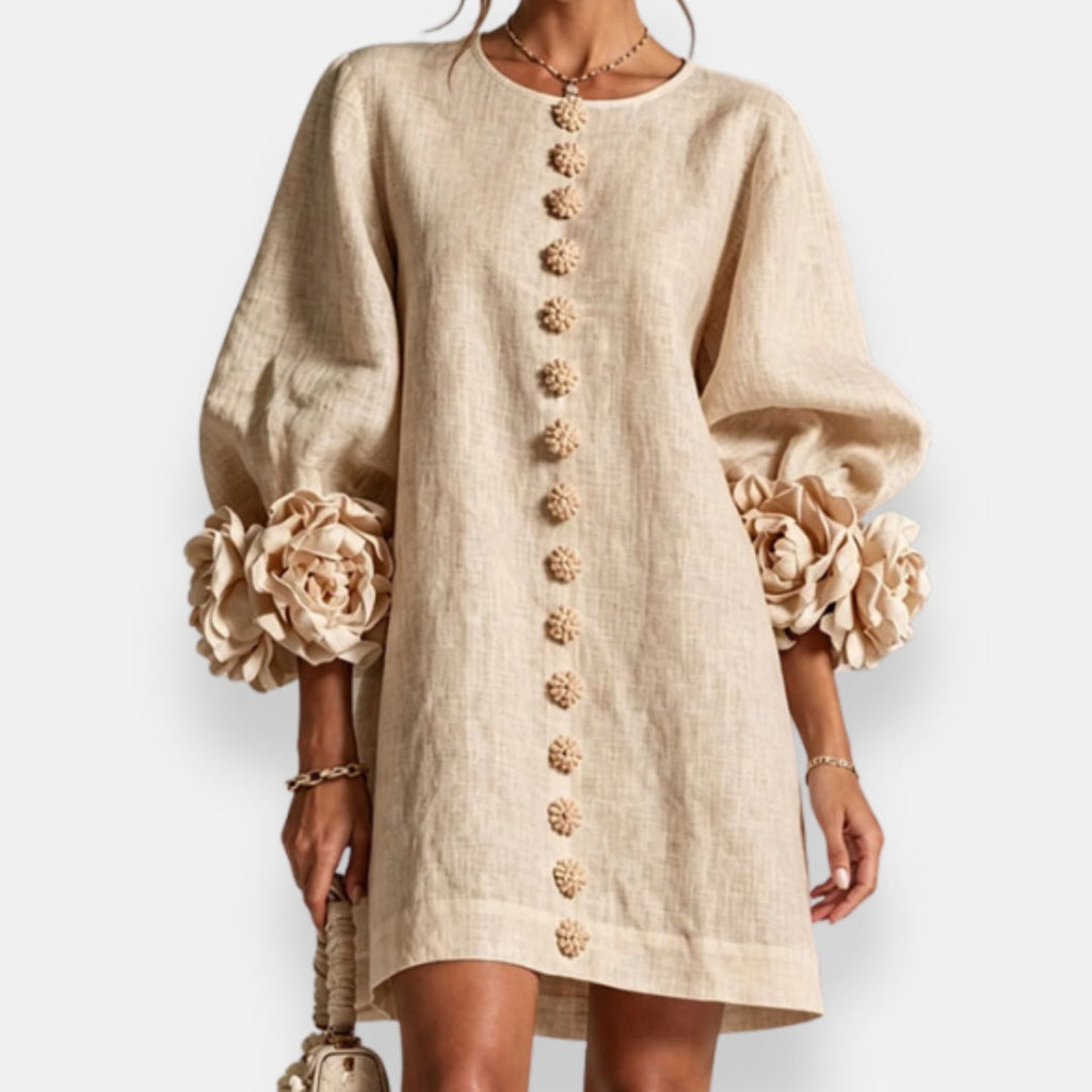 Texture shot of the lightweight and breathable fabric of the grey embossed floral dress, emphasizing its soft feel.