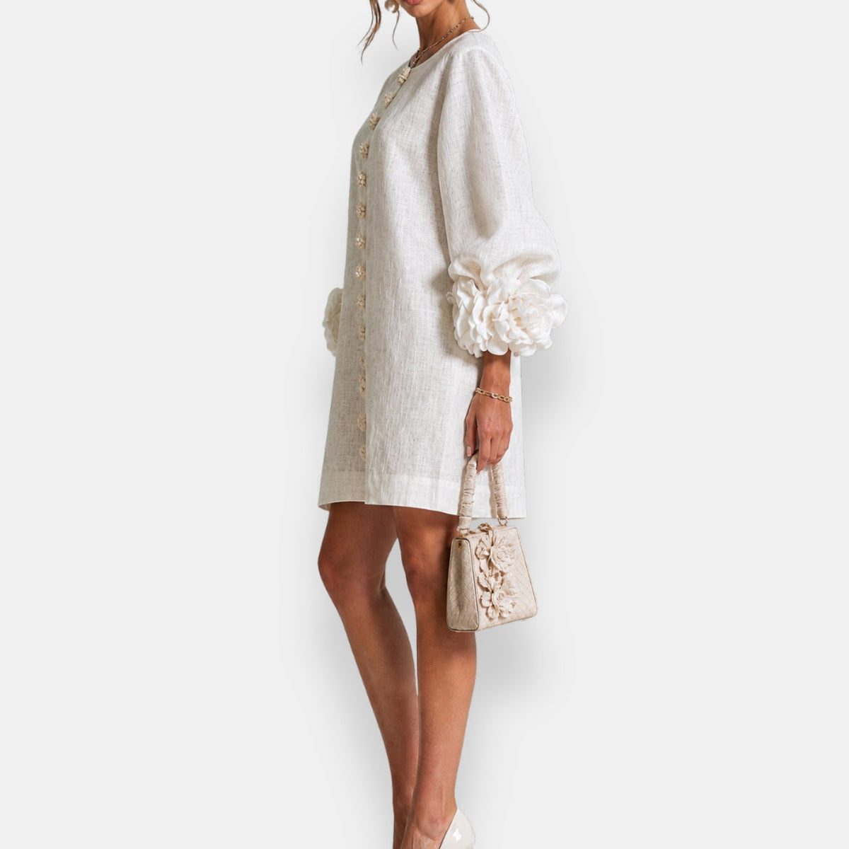 A model in the apricot embossed floral dress enjoying a sunny day, illustrating its breathability and freedom of movement.