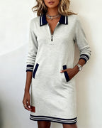 Close-up of the half-zip neckline on the dress, showing the contrasting polo-style collar.