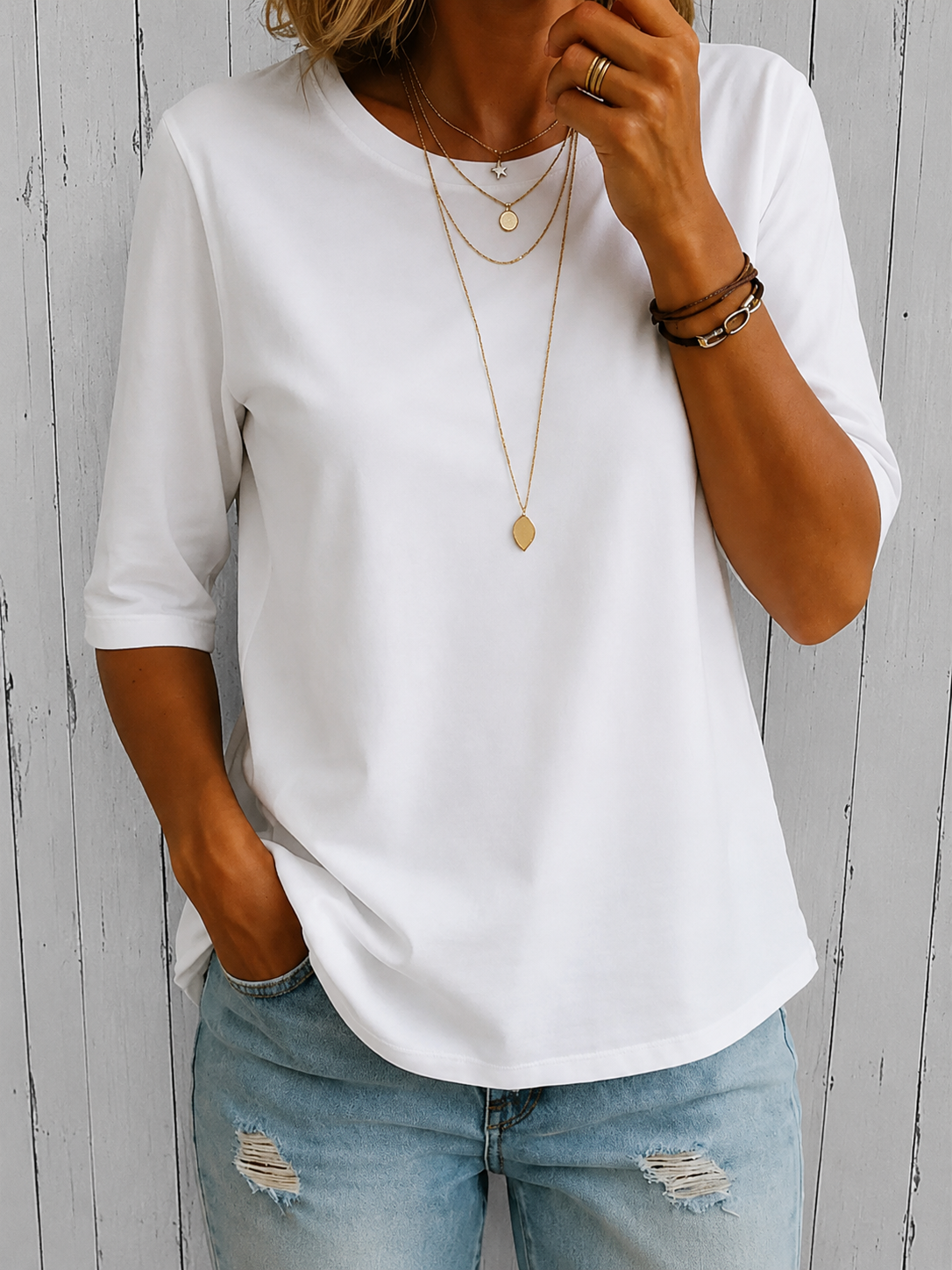 Close-up detail of the soft fabric texture and classic round neck of the comfortable t-shirt.