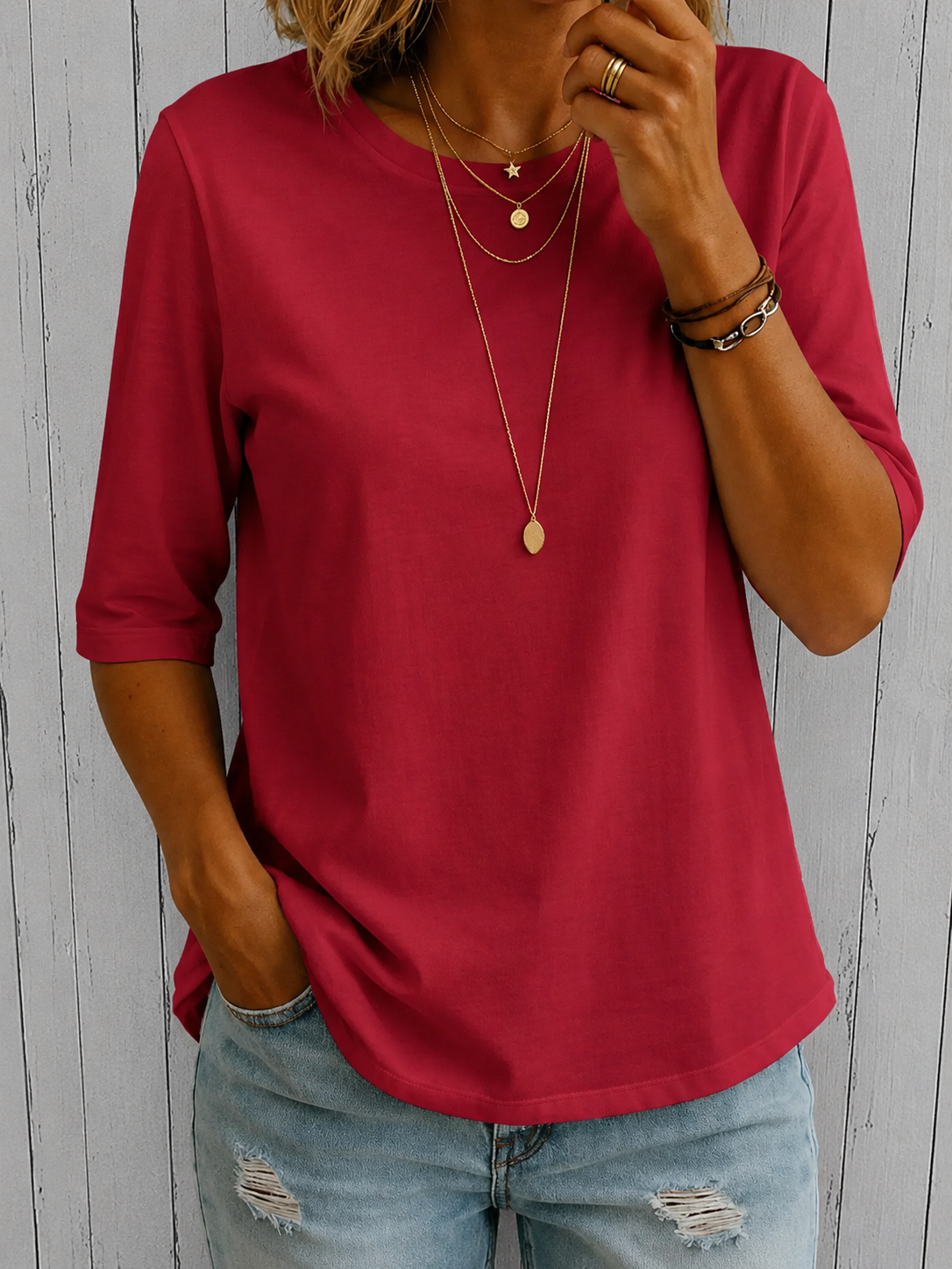 Woman enjoying a casual outdoor setting while wearing the pink relaxed half-sleeve t-shirt.