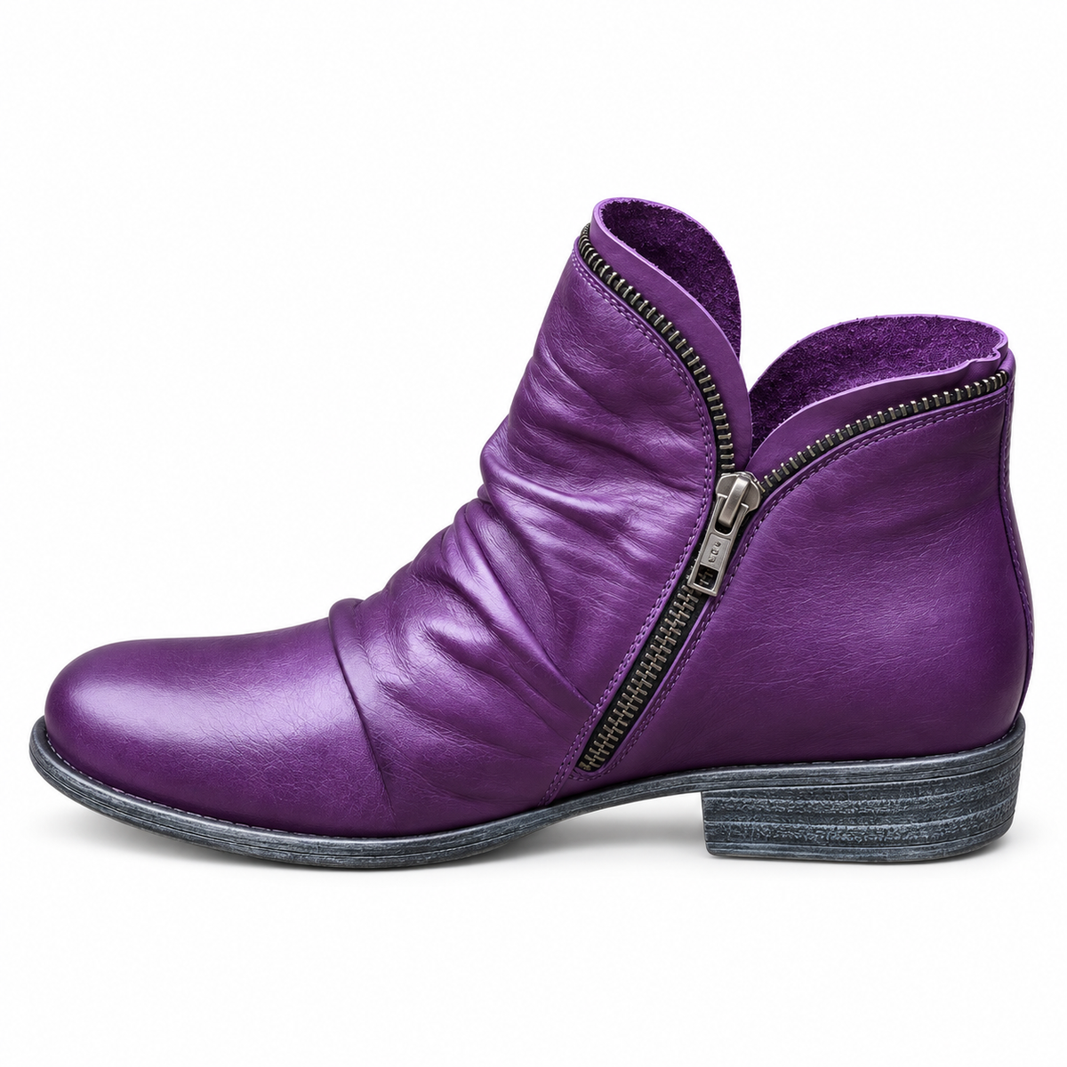 Side profile of a black ankle boot with a stable heel, highlighting its modern silhouette and refined finish.