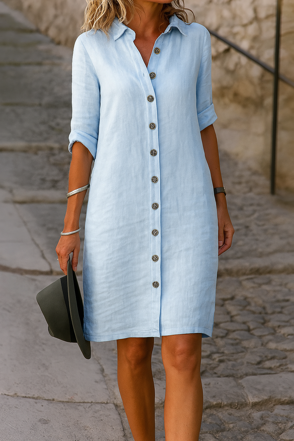 Back view of the light blue linen summer dress, emphasizing the straight silhouette and subtle side slits.