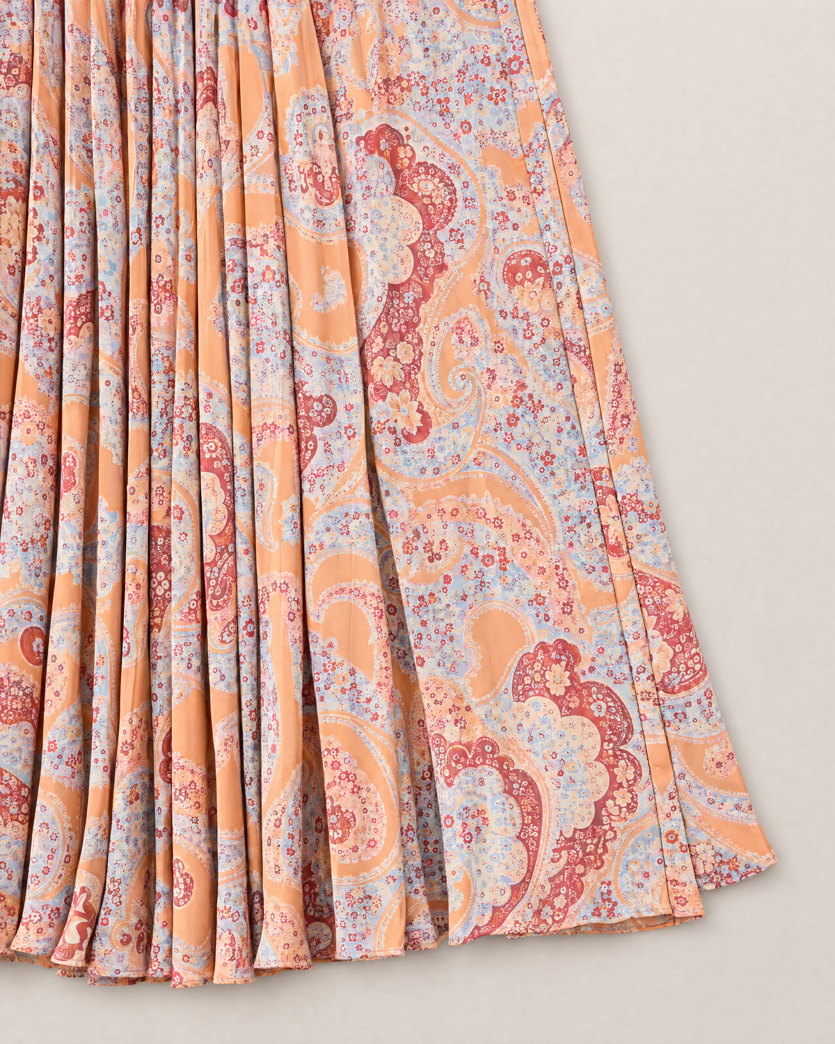 Adelaide Halter Neck Maxi Dress - detail of the fabric and side edge, Orange Paisley