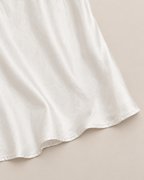 Amara Elegant Midi Skirt - detail of the fabric and hem, White