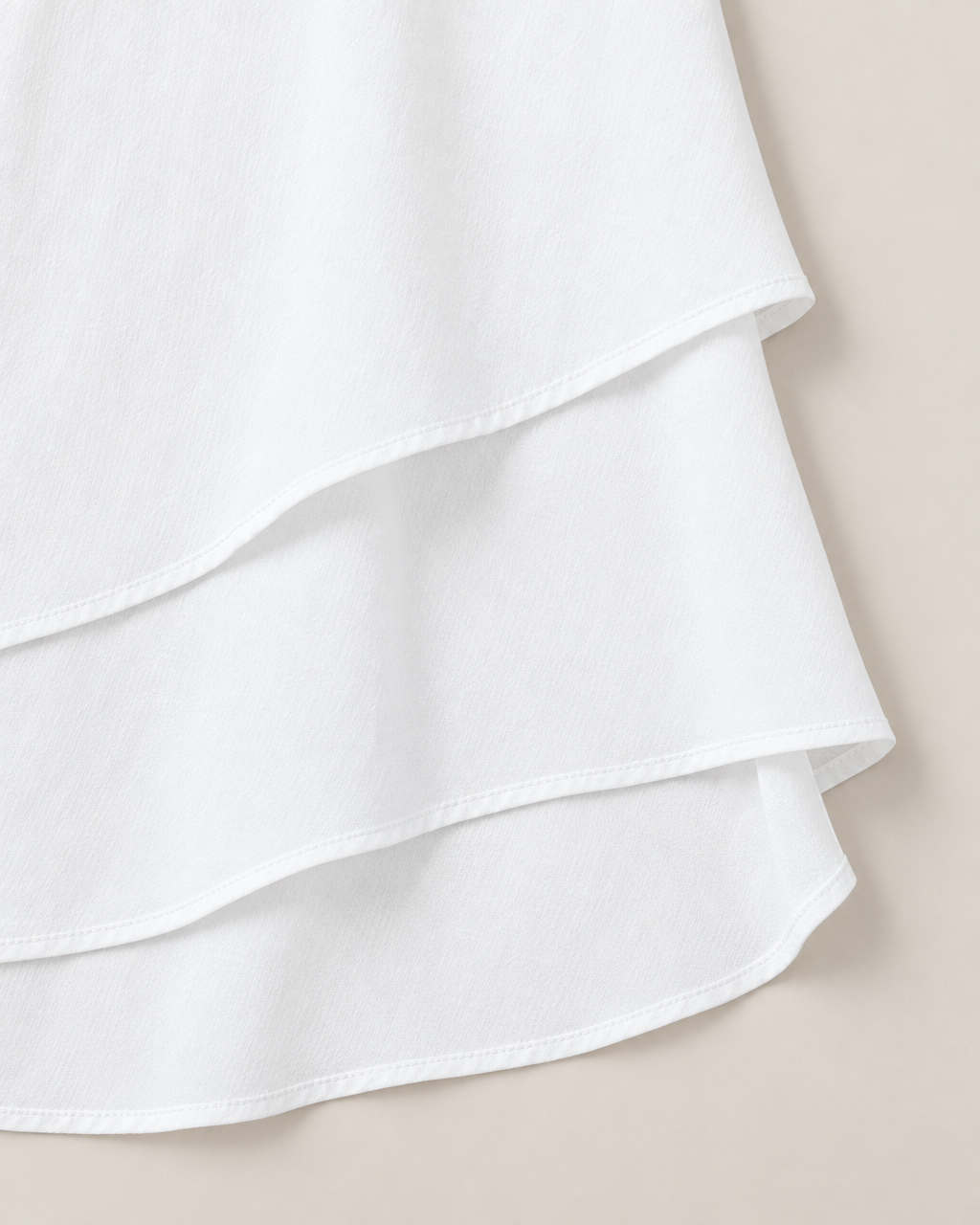 Anya Effortless Flowy Blouse - detail of the fabric and hem, White