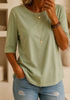 Full length shot of a woman confidently posing in the light grey relaxed half-sleeve t-shirt.