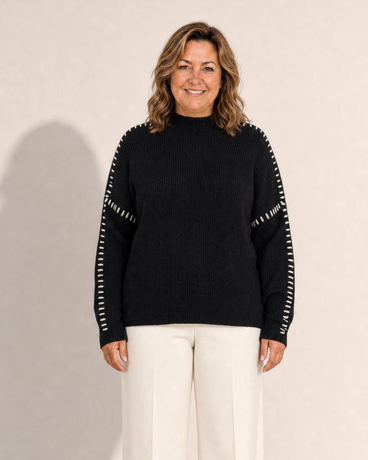 Adeline wearing the Elvira Black Knit Sweater in the Adeline Wear studio