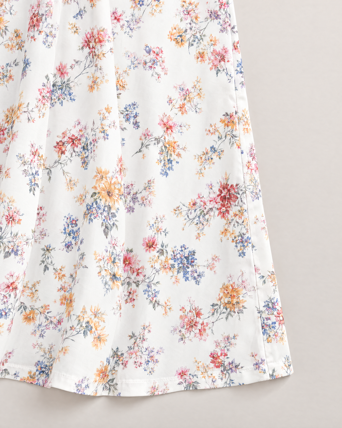 Estelle Elegant Floral Midi Dress - detail of the fabric and side edge, White