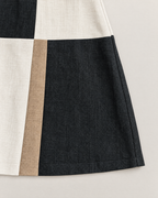 Esther Elegant Halter Mini Dress - detail of the fabric and side edge, Black Colorblock