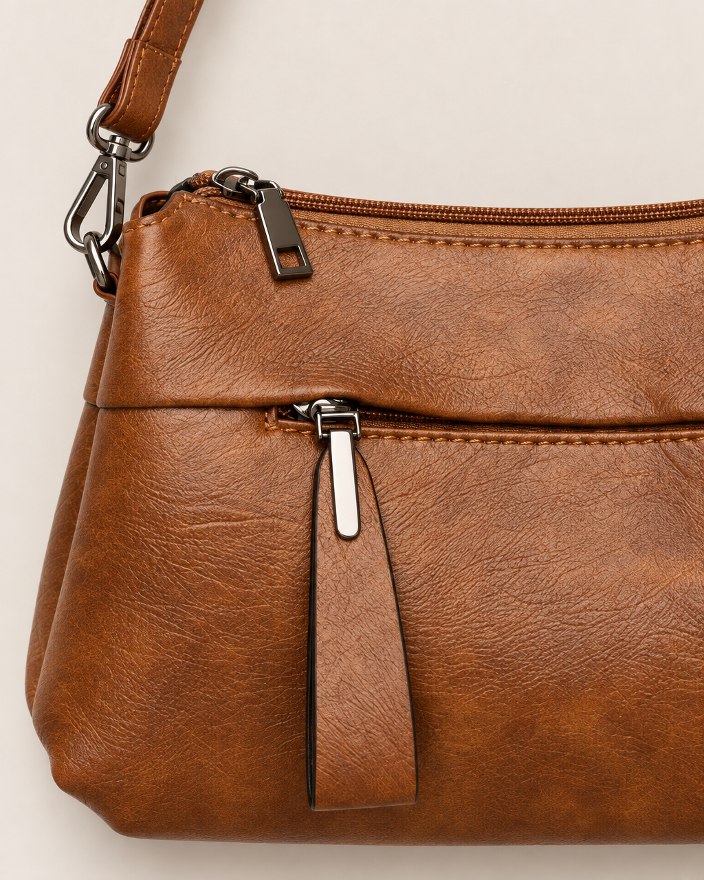 Genevieve Organized Everyday Crossbody Bag - detail of the top edge and closure, Brown