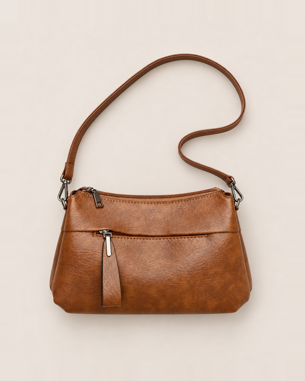 Genevieve Organized Everyday Crossbody Bag - Brown flat lay, top zip, zipped front pocket with a long pull tab, clasp on strap