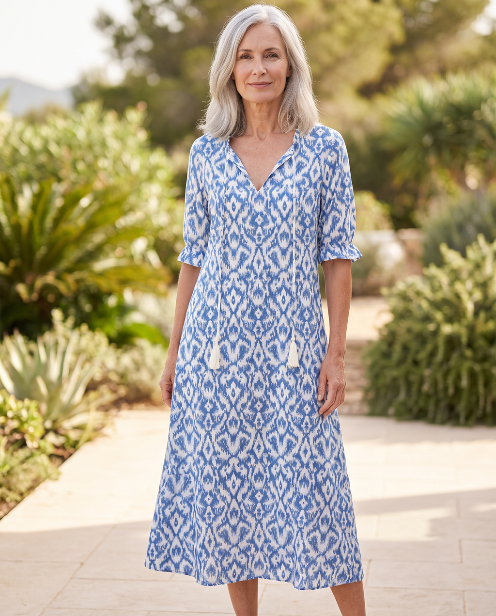 Solara A-line Midi Dress worn by a woman, Adeline Wear