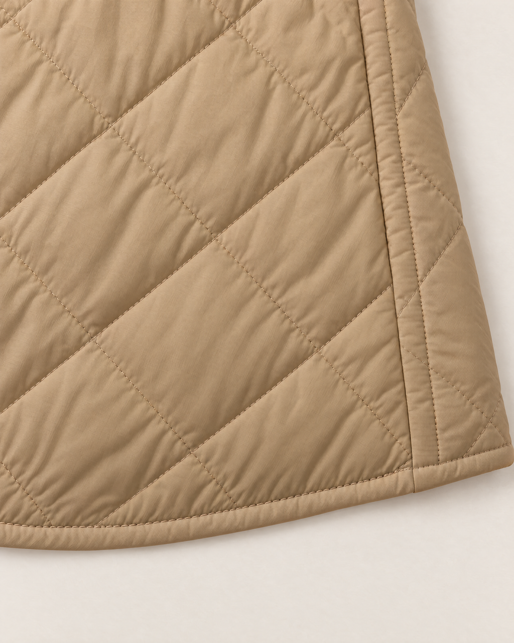 Maeve Lightweight Quilted Jacket - detail of the fabric and hem, Khaki