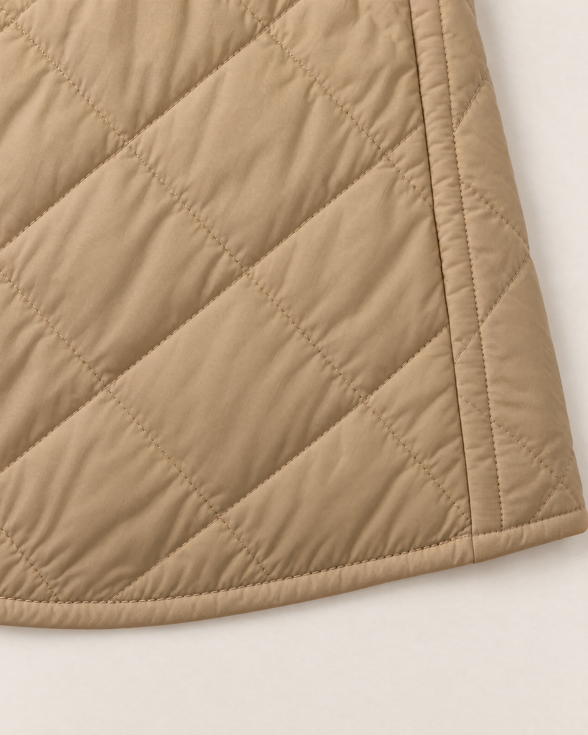 Maeve Lightweight Quilted Jacket - detail of the fabric and hem, Khaki