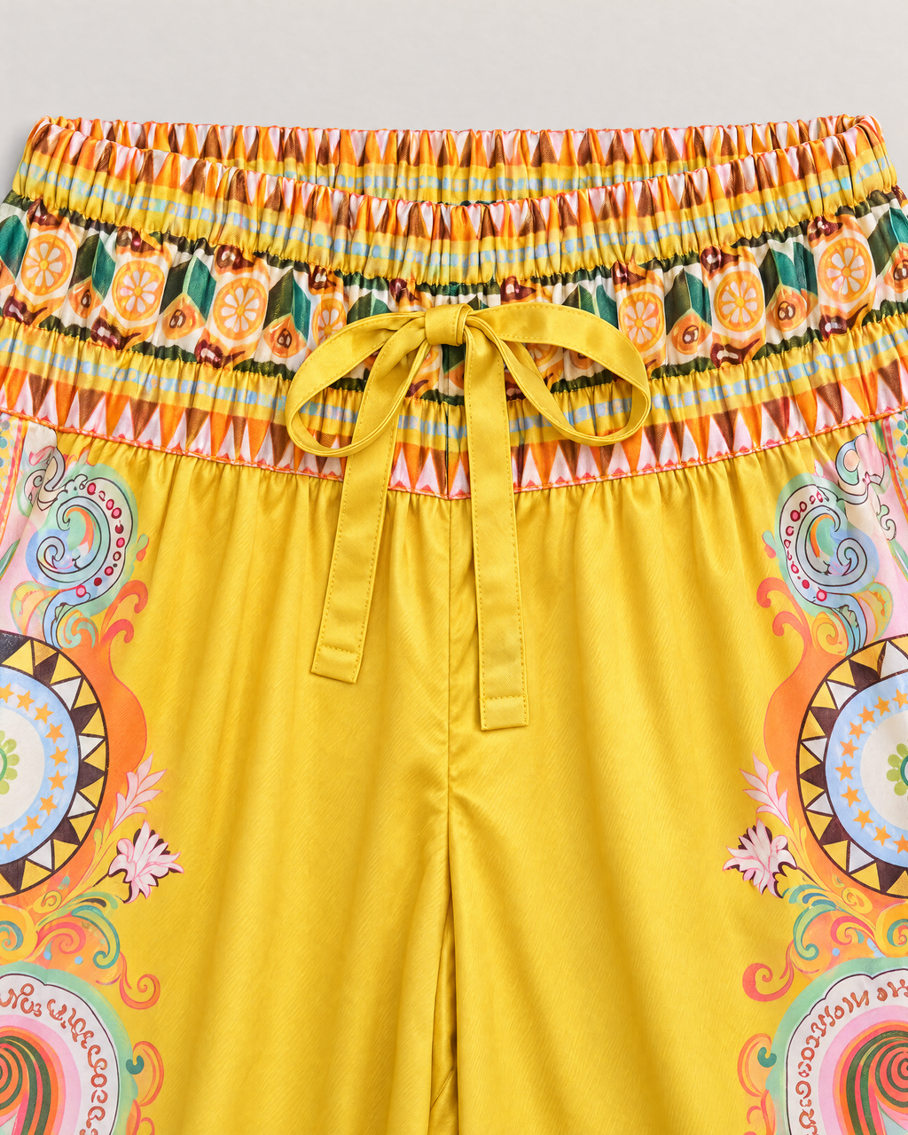 Penelope Paisley Satin Shirt and Pants Set - detail of the bottoms' waistband and fabric, Yellow